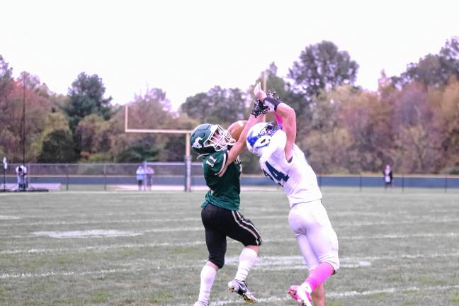 <b>Sussex Tech wideout Anthony Caroleo (11) is unable to catch the ball as the pass is broken up by Kittatinny cornerback Vinny Falchetta in the first half.</b>