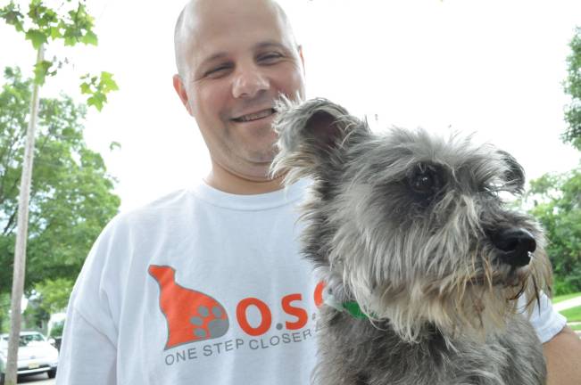 Photos by Robert Oszust Volunteer Andy Choffo and his foster dog Sabastian.
