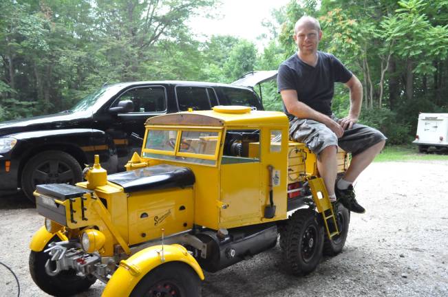 Martin Hardy sits on top of the 1/3 scale &quot;Baby Scammel&quot; that his dad, Dave Hardy, built in honor of the Pioneer Scammell that he drove for 40 years while serving in the British military.