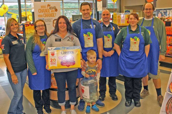 From left, Partners in Caring Captain Kayla Steele; Stanhope Auxiliary Member, Katie Ely; Partners in Caring Captain Patty Gates; Byram Fire Fighter, Will Garcia; Byram Fire Chief, Todd Rudloff; Hopatcong EMS, Rhi Bender; Mayor of Byram, Alex Rubenstein; and our youngest bagger trainee, Cole Garcia.