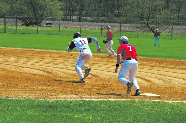 A Newton player runs to second base following an at-bat by a teammate.