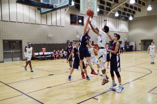 American Christian Eagle Ethan Brennan blocks the shot of Veritas Christian Lion David Lacopo.