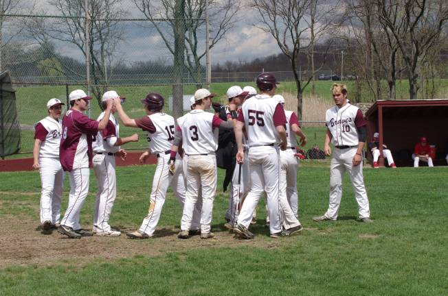 The Braves celebrate the 10-0 victory May 4 against the Patriots.