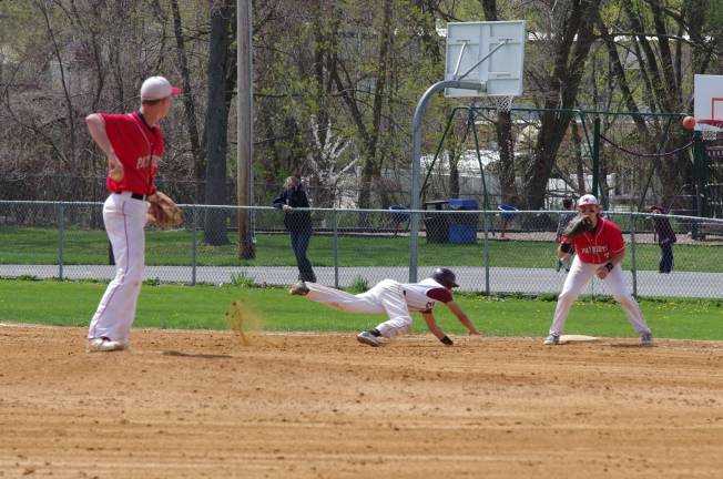 Lenape Valley pitcher Jim Fluke attempts to pick-off a Newton base runner.