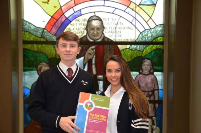 Junior Peter Corcoran and Senior Marina Veliz, members of the Pope John Catholic Schools Week Committee.