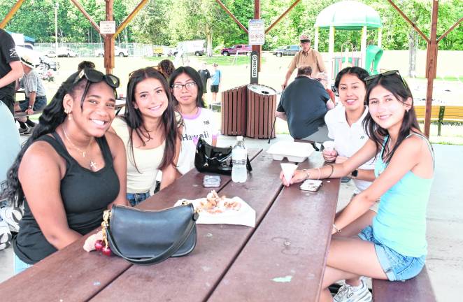 Tamara Taylor of Newton, Nancy Narvaez of Newton, Javier Arechiga of Newton, Lucian munoz of Newton and Jacy Kerner of Andover sit at a table.