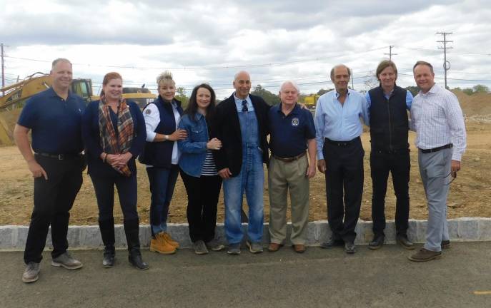 (L-R): Owen Dykstra, Sparta Mayor Molly Whilesmith, Sparta Councilwoman Christine Quinn, Rachael and Steve Scro, Sparta Councilman Jerry Murphy, Dimitris Prassas, Mark Konarsky, and Sparta Police Chief Neil Spidaletto gather for the groundbreaking of Modern Farmer on Tuesday, Sept. 24, 2019 at North Village at Sparta.