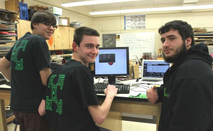 Team 3142 Newton Robotics Team programmers Cameron Osborn, Michael Groschadl and Brian Hoskins.