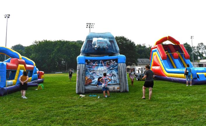 Children play on inflatables.