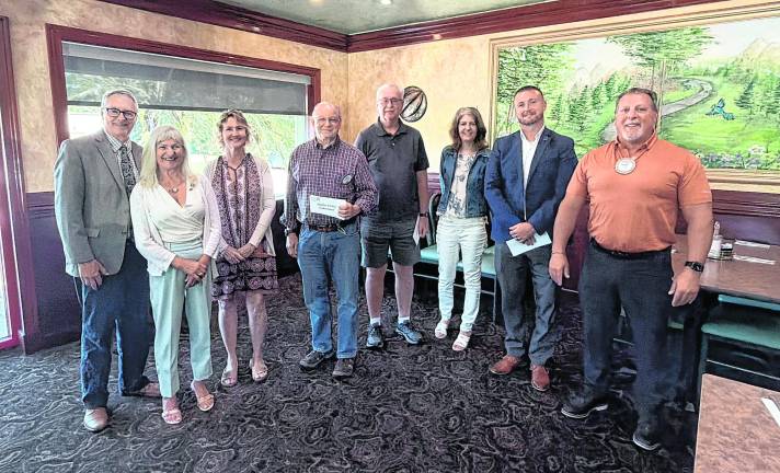 Pictured, from left, Newton Rotary President Charles Grotyohan and Past President Denise Current Hotz with representatives from community service organizations.