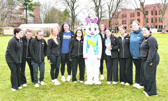 <b>The Sussex County Community College softball team poses with the Easter Bunny.</b>
