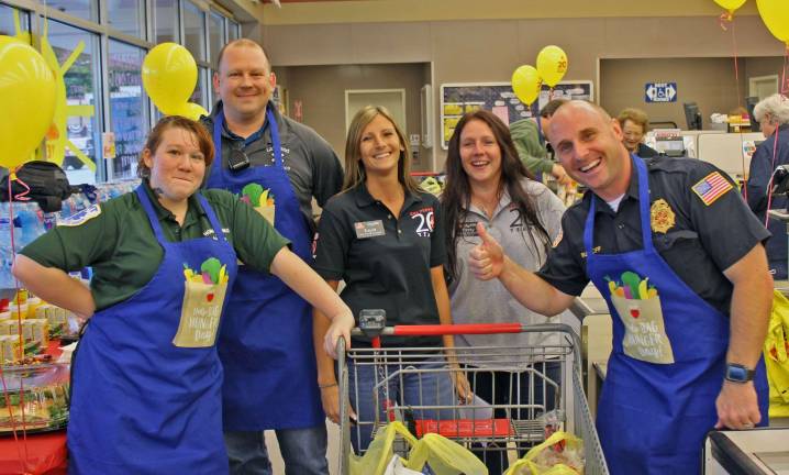 Rhi Bender, Matt Jones, Kayla Steele, Patty Gates, and Todd Rudloff having fun at Bag Hunger Day.