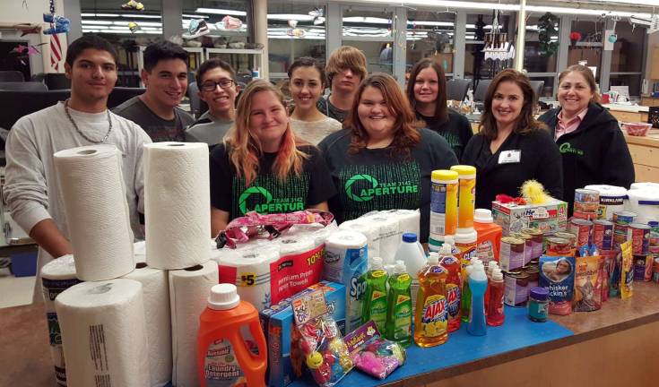 Newton Robotics Team collects supplies for Father John's Animal House. Joel Delarosa, Nick Nannery, Liam Oakes, Kya Savva, Katie Nelson, Jake Kolzow, LaraPennell, Donna Groschadl, Karen Yost and Darleen Nelson.