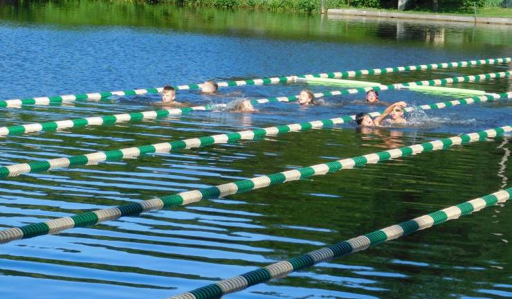 The 7-8 age group takes their swim during the Byram Tri-Harder kids&#x2019; triathlon at Lake Lackawanna on Saturday, June 22, 2019. (Photos by Mandy Coriston)