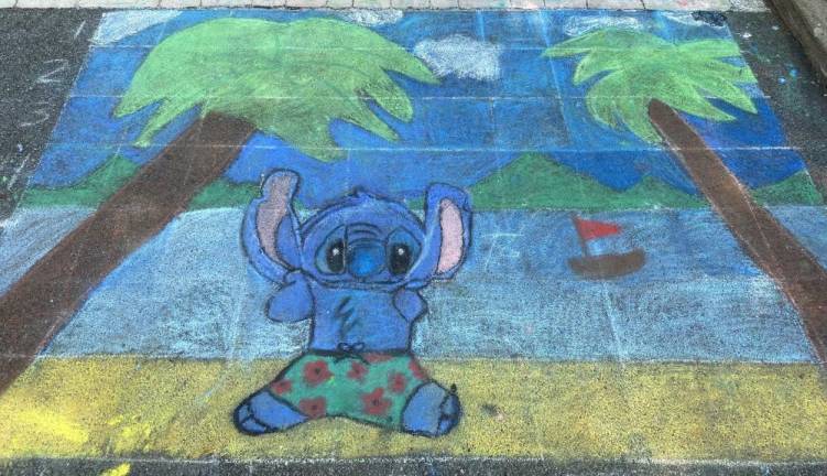 Students create chalk artworks