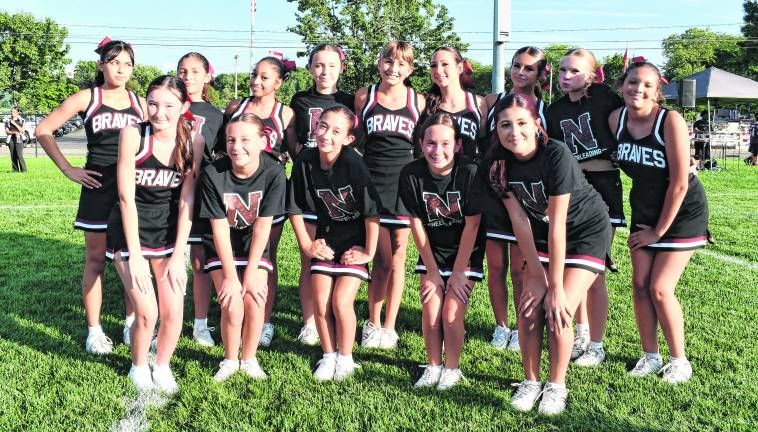 Seventh and ieghth grade cheerleaders pose for a photo.