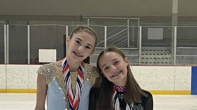 Harper Schmid, left, and Paige Parlapiano trained six days a week before the competition.