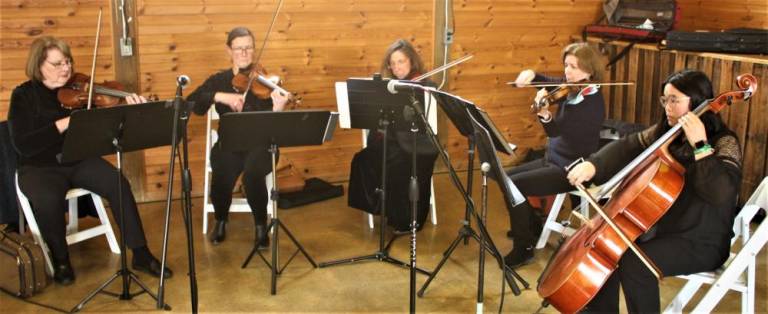 A string quartet from the New Sussex Symphony, a grant recipient, provided entertainment at the Give Back Event on March 12.