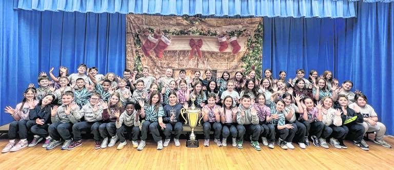 <b>Students from Reverend George A. Brown Memorial School with the Stuff the Stocking trophy.</b>