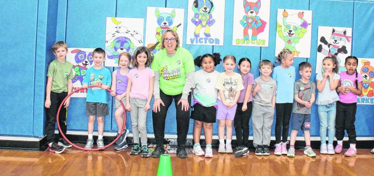 Students pose with a teacher at the Kids Heart challenge.