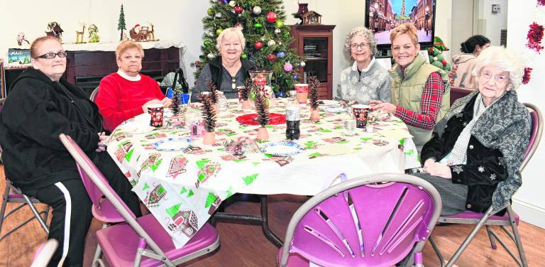 Lisa Dehope (lives in Liberty Towers), Joyce Franklin ( Liberty Towers). Marilyn Miller (Liberty Towers), Rosalie Monaco of Newton, Maureen Cuff of Newton and Mary Schnoover of Liberty Towers sit at a table.