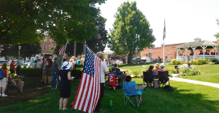 Dozens gather in the shade on the Newton Green for a reading of the Declaration of Independence, on Thursday, July 4, 2019. (Photos by Mandy Coriston)