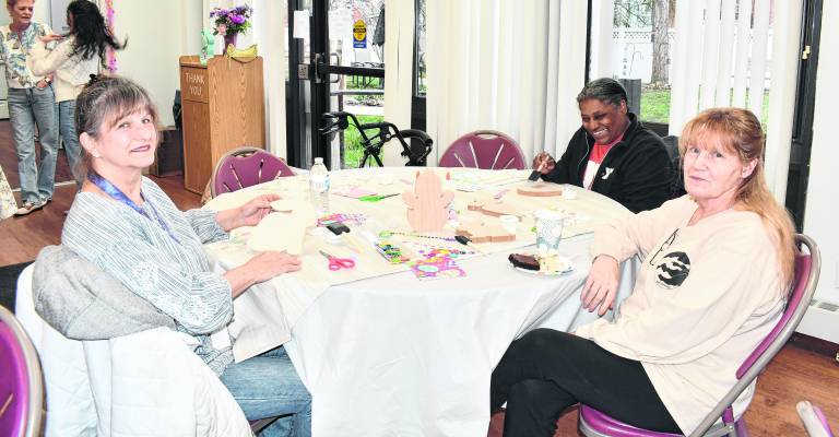 Doris Szilasie, Tina Williams and Deborah Bleakley from Newton pose for a photo.