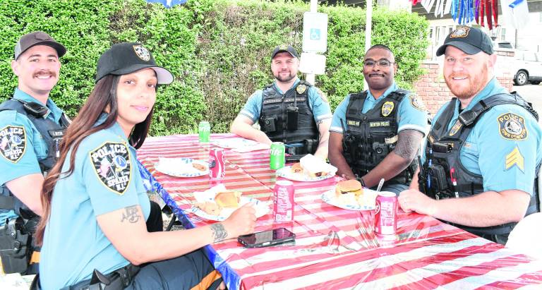 Sparta and Newton police officers pose for a photo.