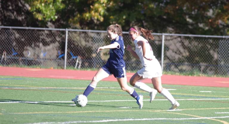 Sparta's Bailey Kellenberger steers the ball while being shadowed by Newton's Grace Young. Kellenberger scored one goal. Photos by George Leroy Hunter