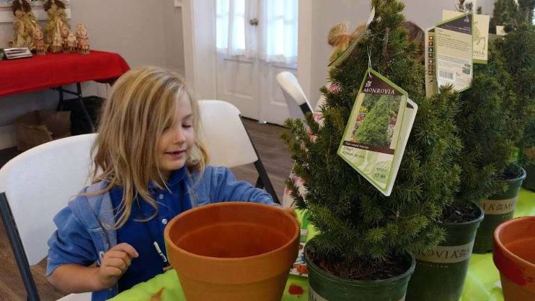 Kaityn Kayser, 9, enjoys painting PHOTOS BY ANYA TIKKA