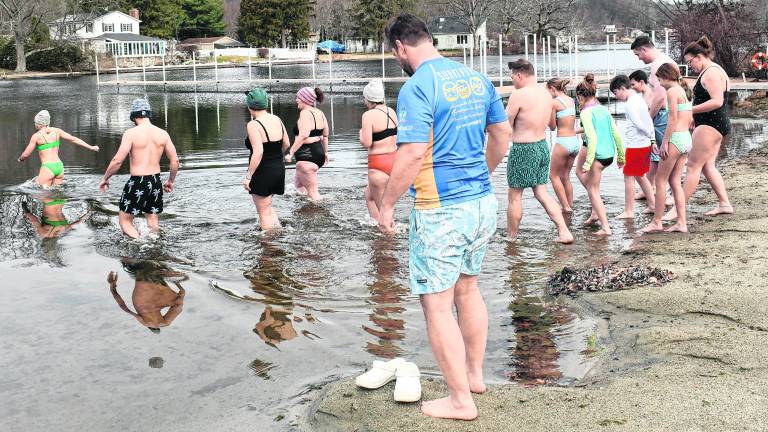 Swimmers go into the water during the Polar Plunge