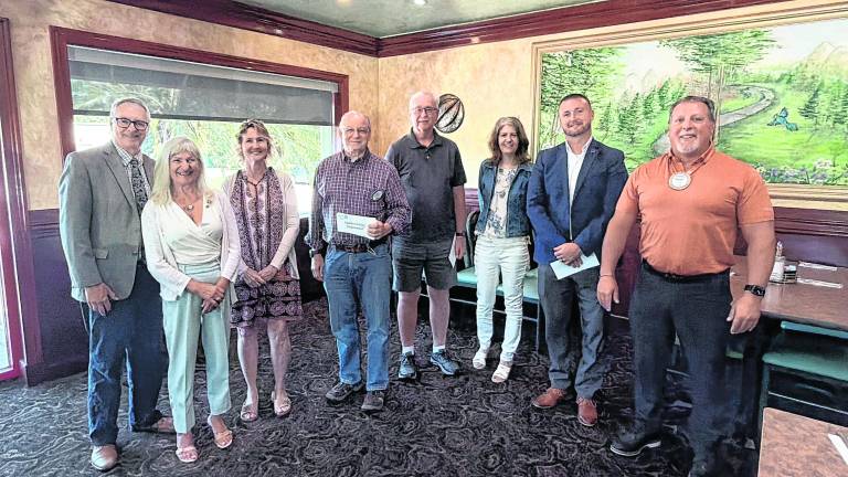 Pictured, from left, Newton Rotary President Charles Grotyohan and Past President Denise Current Hotz with representatives from community service organizations.