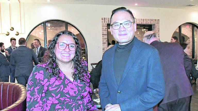 Angelica Chapman of First Hope Bank and Kevin Kuo of White Deer Innovation are shown.