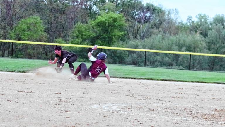 Newton High School softball player Jordyn Young (18) slides safe onto second base in the first inning of the game against Wallkill Valley on May 7. Young scored a run, and the Braves won, 4-0. (Photos by George Leroy Hunter)