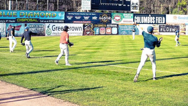 Athletes warm up by playing catch before taking part in open tryouts for the Sussex County Miners on April 26 at Skylands Stadium in Augusta. (Photos by Jay Vogel)