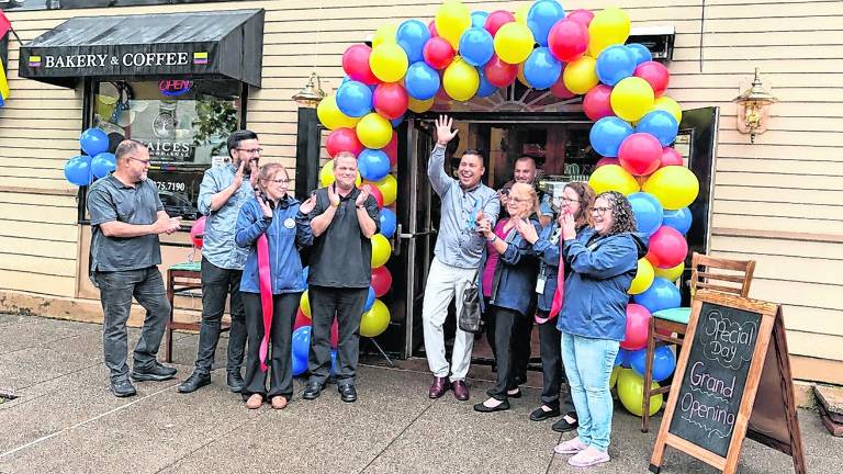 Hector Echeverri, owner of the Raíces Colombianas, celebrates the restaurant’s grand opening.