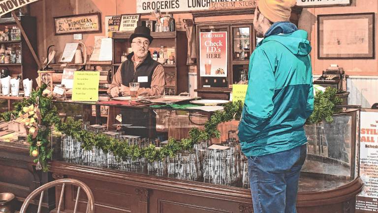 <b>A general store is recreated for the Back in Time Yuletide Stroll last December in Stillwater. (File photo by Maria Kovic)</b>
