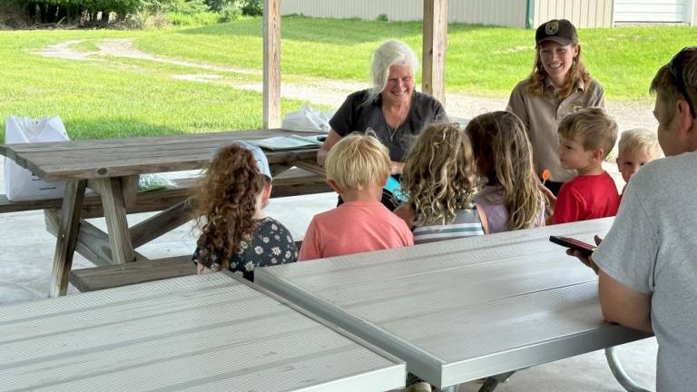Wallkill River National Wildlife Refuge volunteer Donna Provost hosts families attending the nature-themed, interactive story times and activities. (Photos provided)