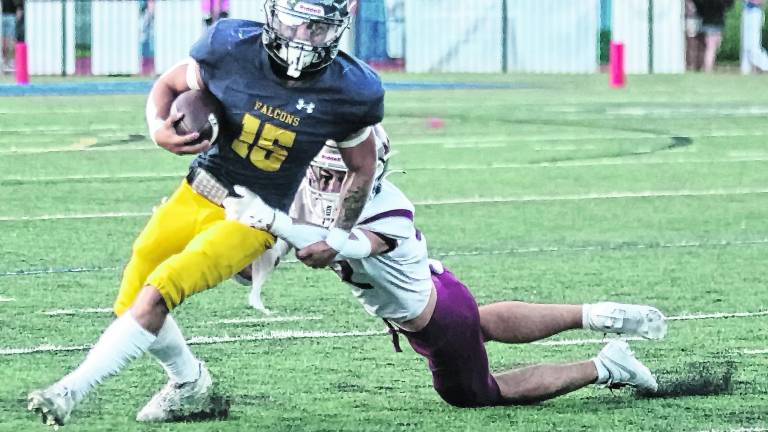 Jefferson ball carrier Braedan Cummings is tackled by Newton defender Braxton Guerra in the first half.