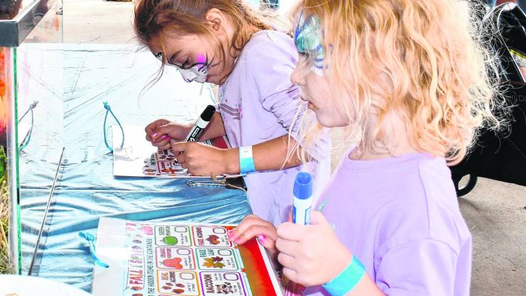 <b>Katherine and Kennedy Kelly of Vernon draw.</b>