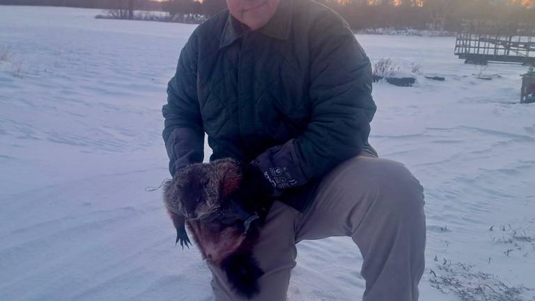 <b>Parker Space is shown with the Sussex County groundhog, Stonewall Jackson.</b>