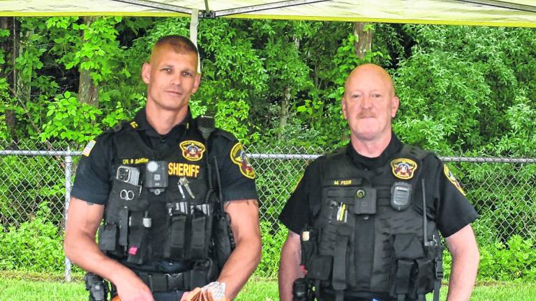 Sussex County Sheriff's Cpl. Robert Schilling and Deputy Mark Peer pose for a photo.