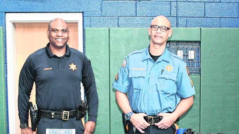 <b>Ronnie Anglin and John Henderson of the Morris County Sheriff's Dept. of Corections ose for a photo.</b>