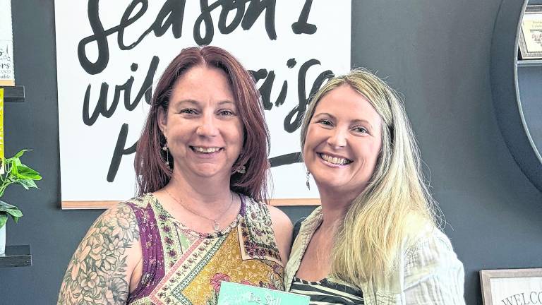 Pictured, from left, are Heather Olla, a stylist at Devine Designs, and author Everly Lane celebrating the release of <i>Be Still and Know: A 31-Day Guide to Manifesting God’s Blessings</i>.