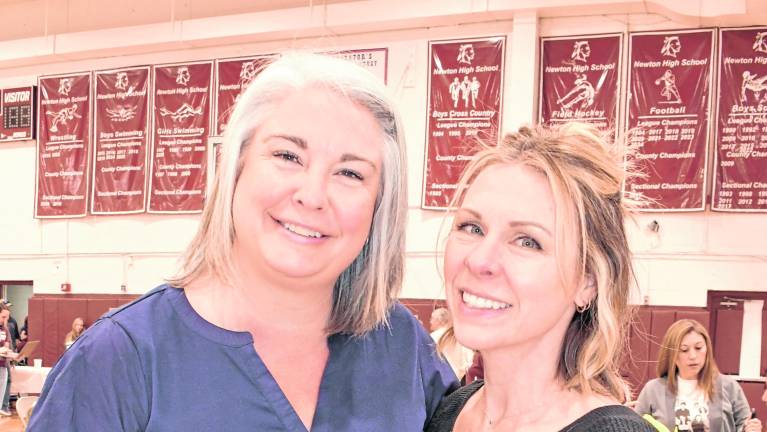 Jullie Willis and Nicole Malcolm, both of Green Township, pose for a photo.