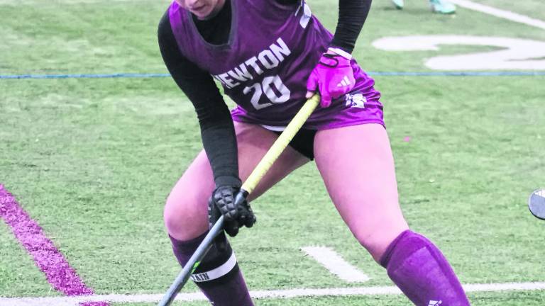 Newton's Emma Trout controls the ball.