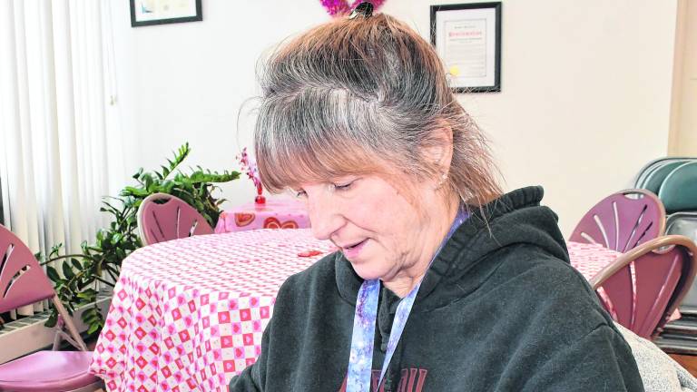 Doris Szilasie of Newton works on a craft.