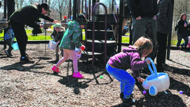 Children hunt for Easter eggs Sunday, March 24 in Musconetcong Park in Stanhope. More than 100 took part in the annual event, which was postponed from Saturday because of rain. (Photos by Maria Kovic)