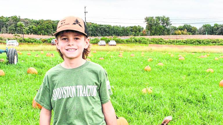 Landon Nichols of Frankford shows off his pumpkins.