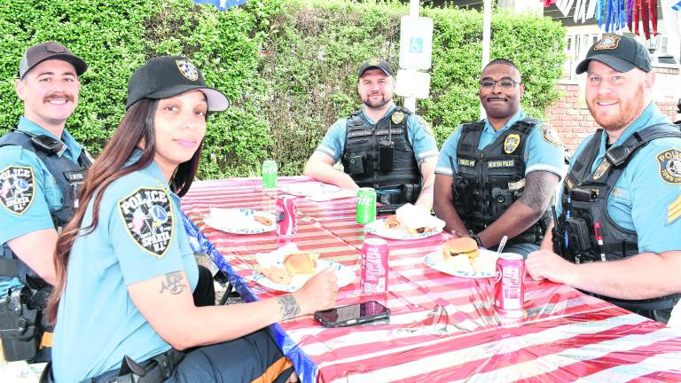 Sparta and Newton police officers pose for a photo.